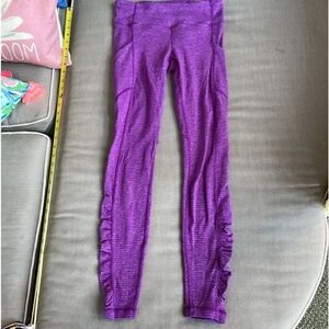 Lululemon heavy weight purple leggings with back zip and phone pockets. Size 6